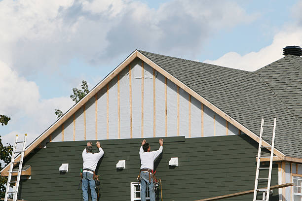 Professional Storm Damage Siding Repair technician working in Wellington, FL